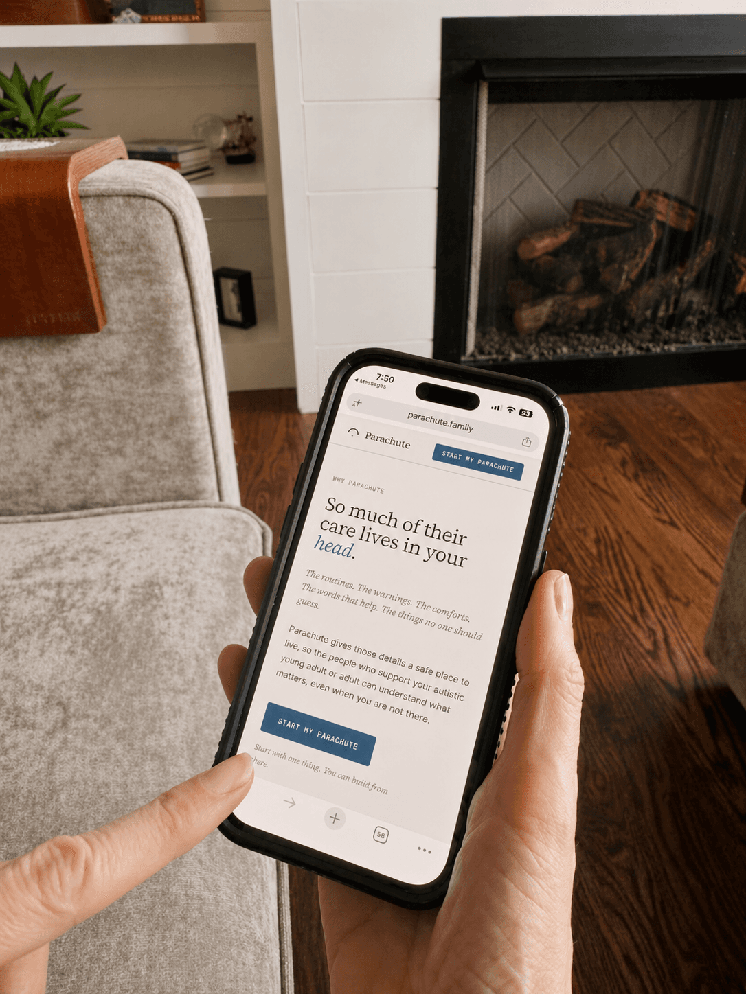 A parent holding their phone open to Parachute, in a quiet living room.